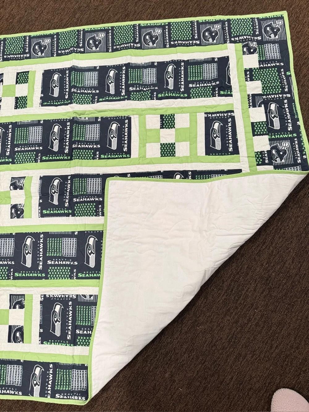 A beautifully crafted, one‑of‑a‑kind handmade throw featuring four detailed trai